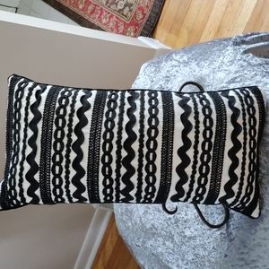 Decorative black and white pillow.